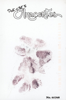 Two dog paw prints made with an ink pad.